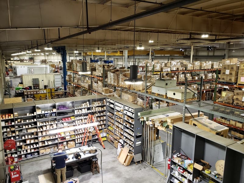Overhead view of PRM's Butner, NC facility with parts inventory shelving and manufacturing floor