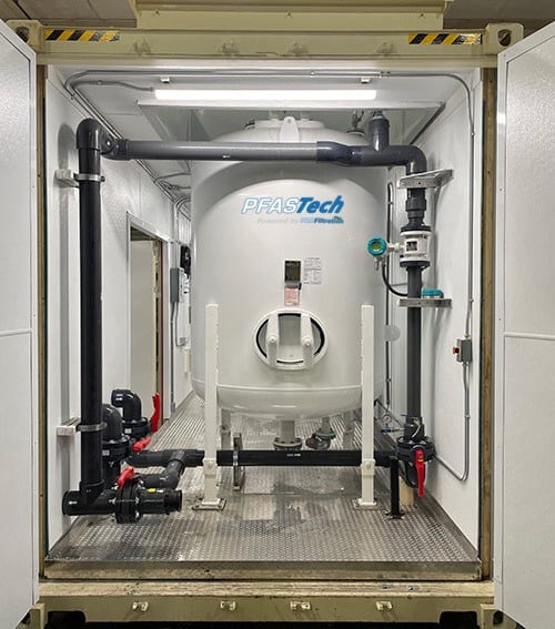 PFASTech containerized GAC treatment vessel with piping for residential PFAS removal