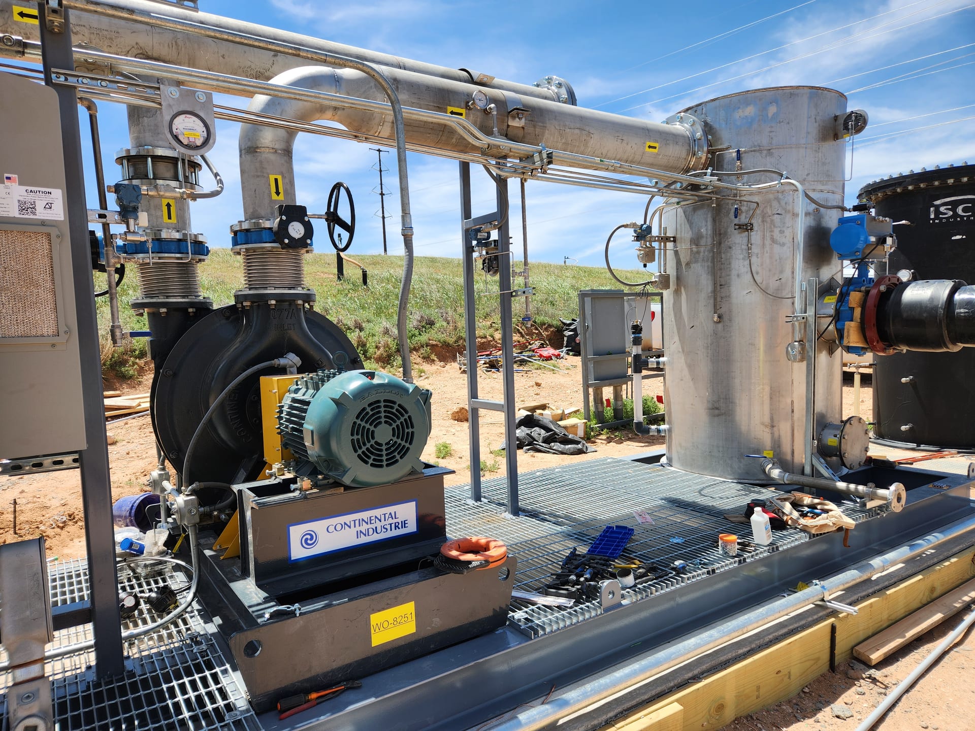 Landfill gas filtration skid with centrifugal blower and stainless steel dehydration vessel at a landfill site